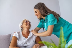 Nurse caring for elderly woman